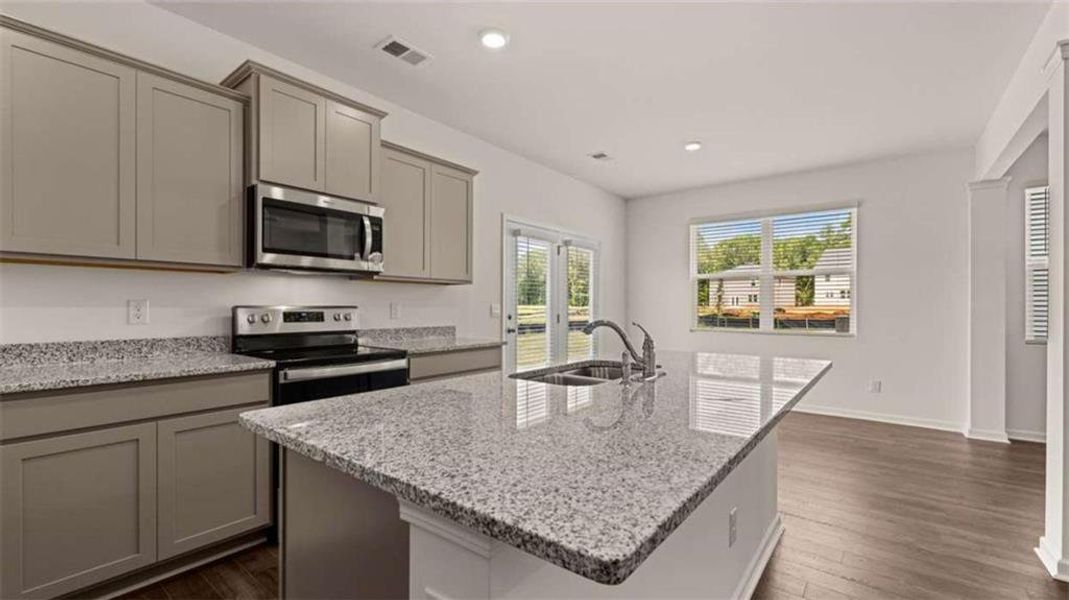 Furnished interior view inside a new home in Oakchase at Hampton, Hampton (Image 8).