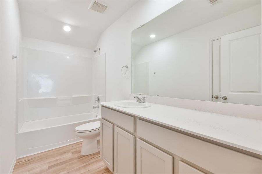 Large guest bath with generous counter space.