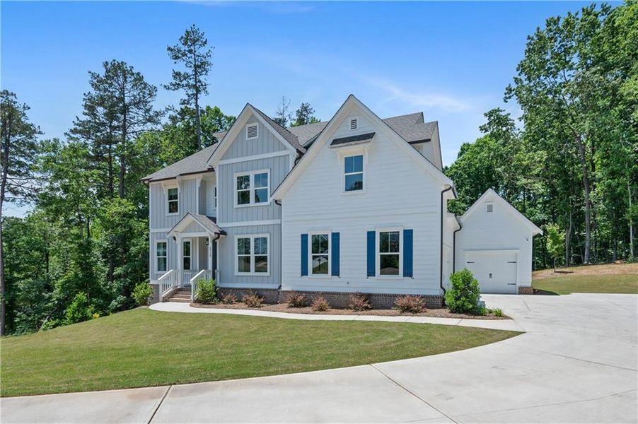 Front exterior of a new home in , Cumming, GA, highlighting curb appeal (Image 19).