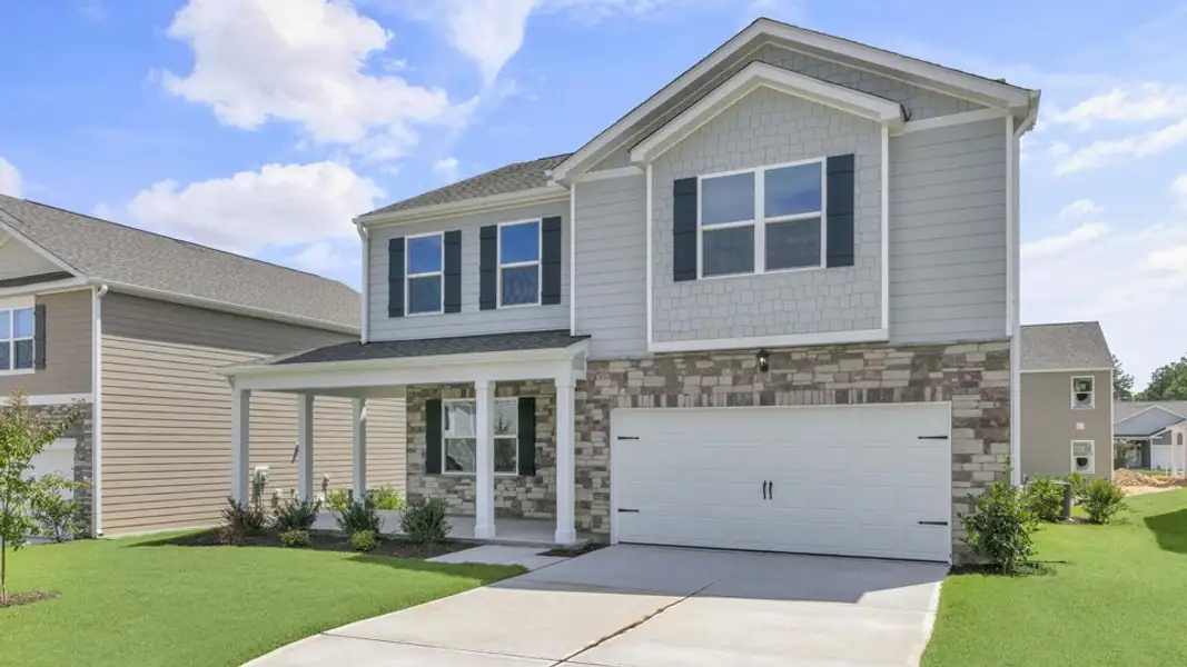 Front exterior of a new home in Tyler - Home on the Lake, New Bern, NC, highlighting curb appeal (Image 2). Front exterior of a new home in Tyler - Home on the Lake, New Bern, NC, highlighting curb appeal (Image 2).