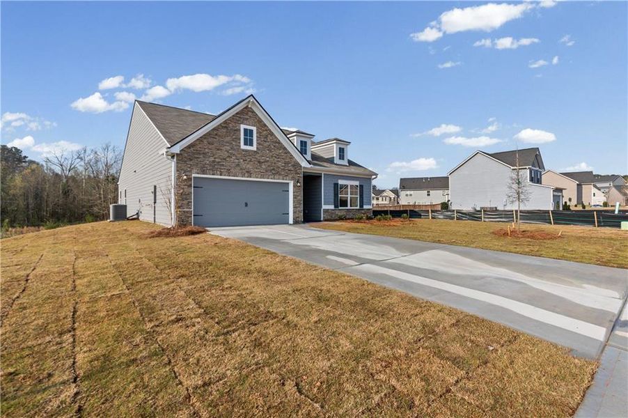 Front exterior of a new home in Maple Village, Adairsville, GA, highlighting curb appeal (Image 20).