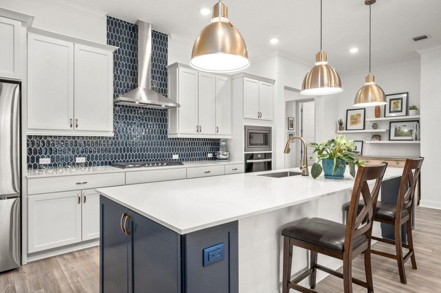 You’ll love the gourmet kitchen and spacious island with quartz counters, pendant lighting, stainless steel appliances, abundant storage, built-ins, and tasteful finishes You’ll love the gourmet kitchen and spacious island with quartz counters, pendant lighting, stainless steel appliances, abundant storage, built-ins, and tasteful finishes