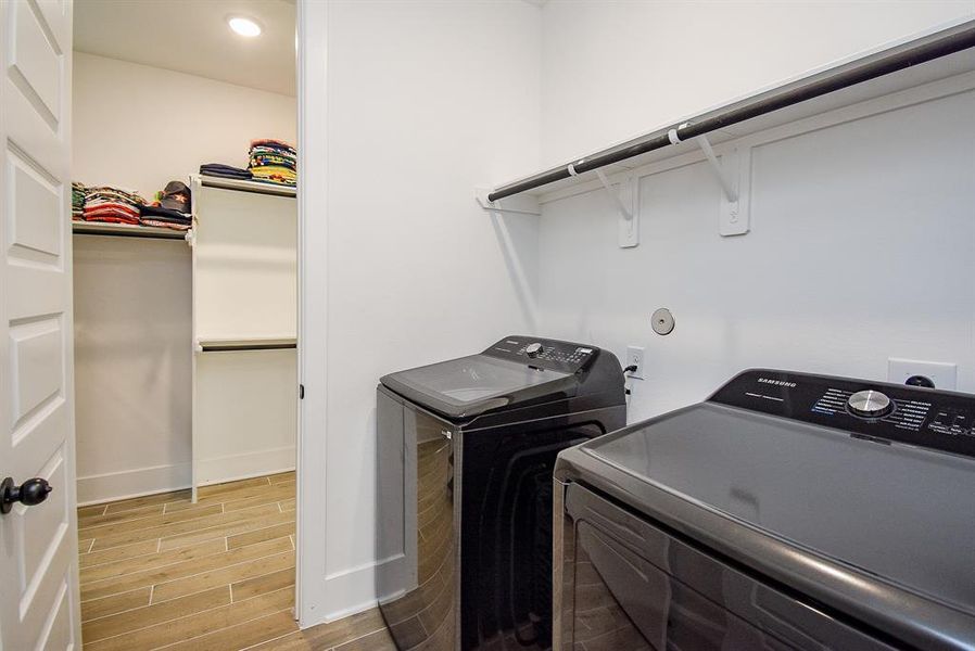 A laundry room with direct access to the primary suite via the primary bedroom closet offers convenience and efficiency, allowing for easy access to clean clothes and linens. This layout enhances the functionality of your home, making laundry chores more manageable.