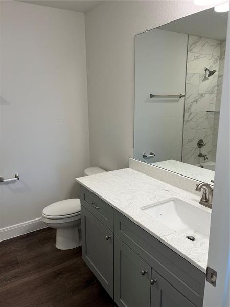 Timeless bathroom selections including quartz countertops with undermount sinks and tiled walls in the shower to the ceiling!