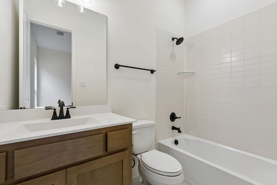 Representative furnished interior of a home built from the Pecos by Sandlin Homes in Settler's Glen, New Fairview (Image 13).