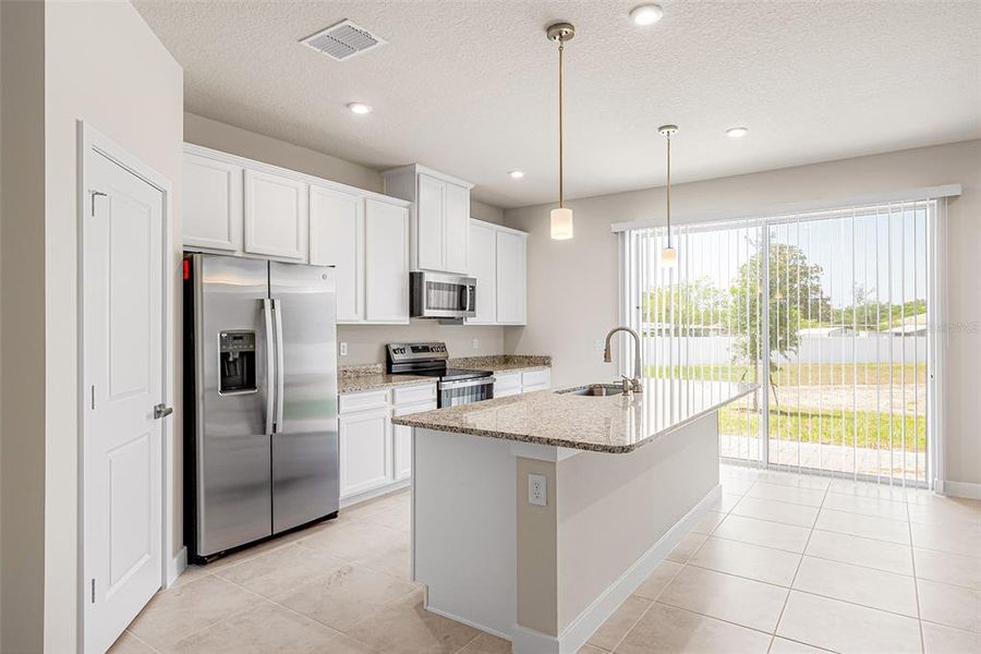 Furnished interior view inside a new home in Kendall Pointe, Melbourne (Image 4).