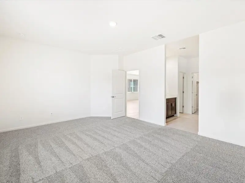 Spacious, unfurnished interior of a new home in Mandarina - Signature Series, Marana (Image 11).