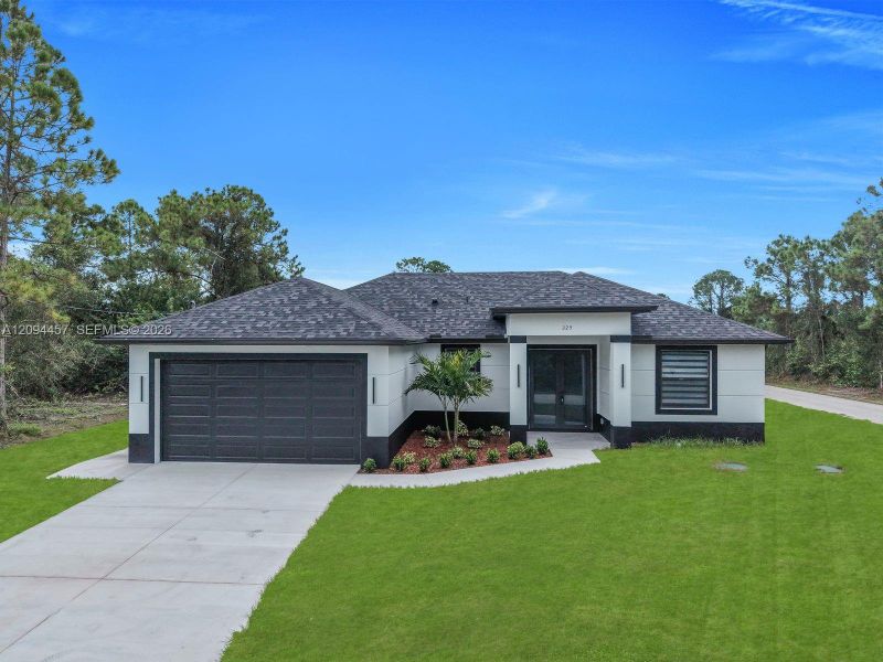 Front exterior of a new home in , Lehigh Acres, FL, highlighting curb appeal (Image 22). Front exterior of a new home in , Lehigh Acres, FL, highlighting curb appeal (Image 22).
