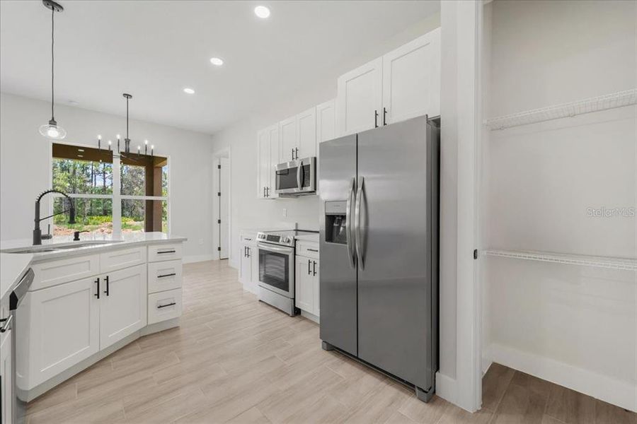 Furnished interior view inside a new home in , Lehigh Acres (Image 6).