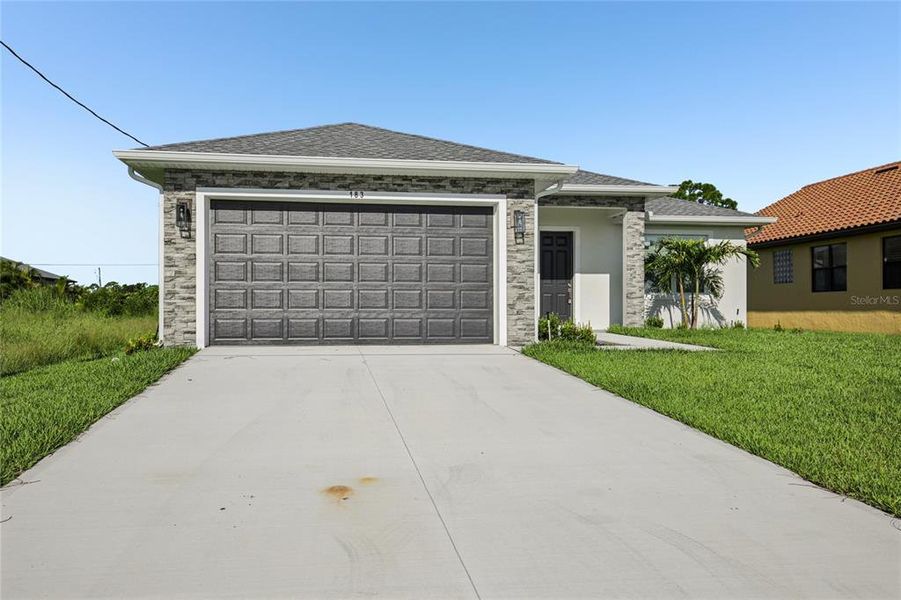 Front exterior of a new home in , Rotonda West, FL, highlighting curb appeal (Image 21).