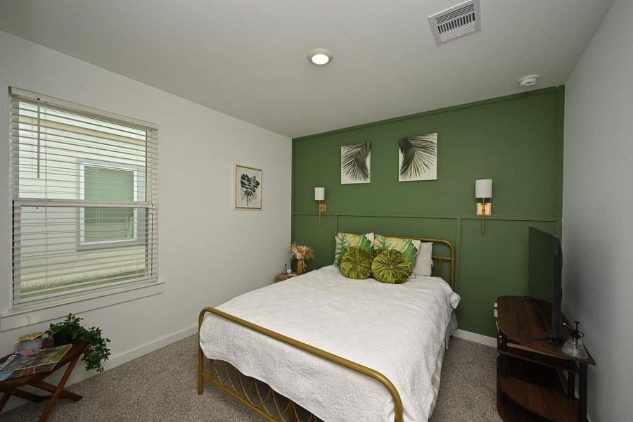 View of the beautiful 2nd bedroom with natural light creating a relaxing atmosphere. View of the beautiful 2nd bedroom with natural light creating a relaxing atmosphere.