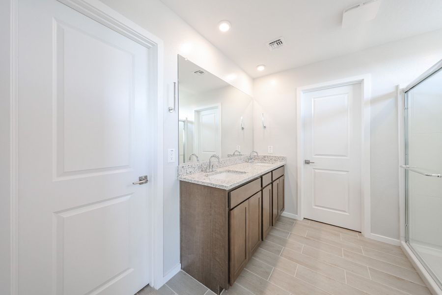A bathroom with a marble countertop.