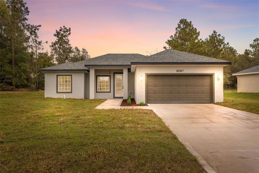 Front exterior of a new home in , Ocala, FL, highlighting curb appeal (Image 1).
