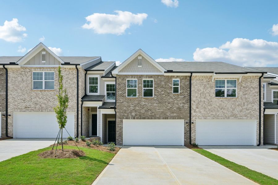 Front exterior of a new home in Kendall Grove, McDonough, GA, highlighting curb appeal (Image 1). Front exterior of a new home in Kendall Grove, McDonough, GA, highlighting curb appeal (Image 1).