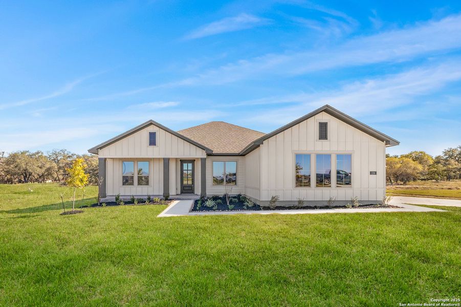 Front exterior of a new home in Pradera Ridge, Floresville, TX, highlighting curb appeal (Image 2). Front exterior of a new home in Pradera Ridge, Floresville, TX, highlighting curb appeal (Image 2).