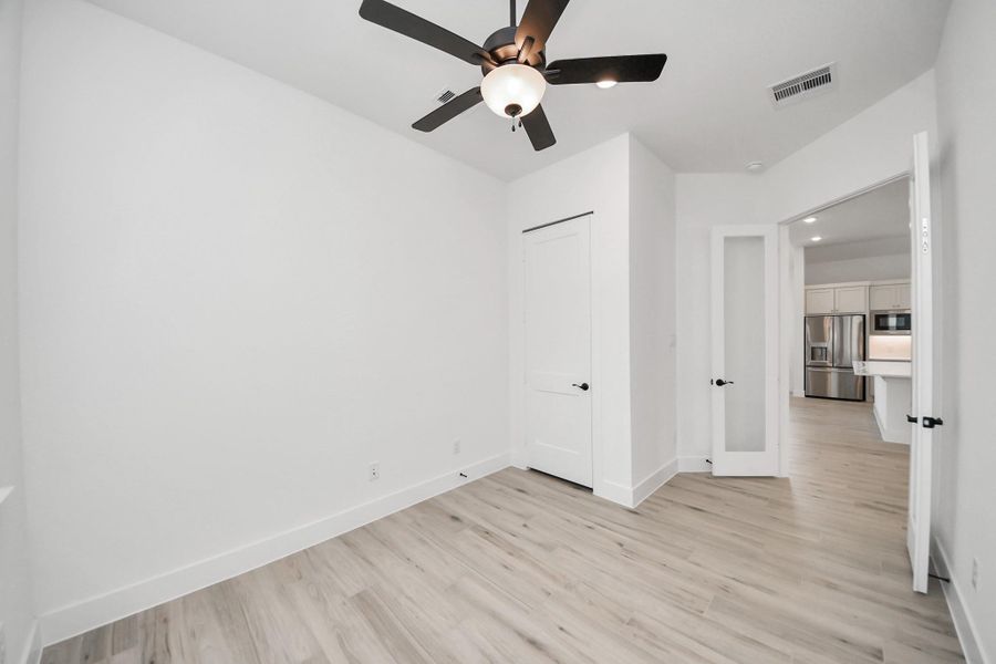 Spacious, unfurnished interior of a new home in Meridiana Courtyard Collection, Manvel (Image 25).