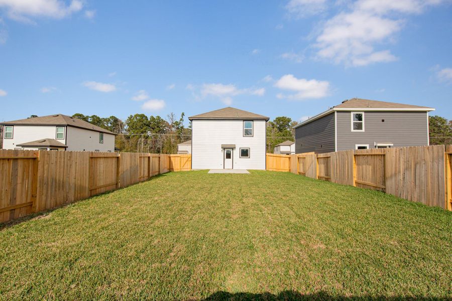 Exterior details and patio area of a home in Townsend Reserve, Splendora (Image 3).