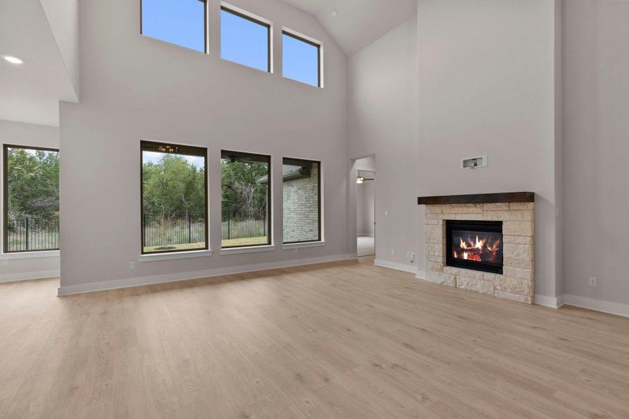 Family Room with soaring ceiling & fireplace