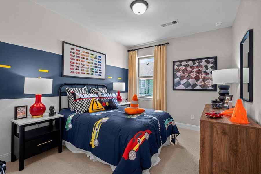 Bedroom with light carpet and baseboards
