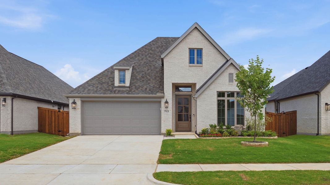 Front exterior of a new home in M3 Ranch, Mansfield, TX, highlighting curb appeal (Image 1). Front exterior of a new home in M3 Ranch, Mansfield, TX, highlighting curb appeal (Image 1).