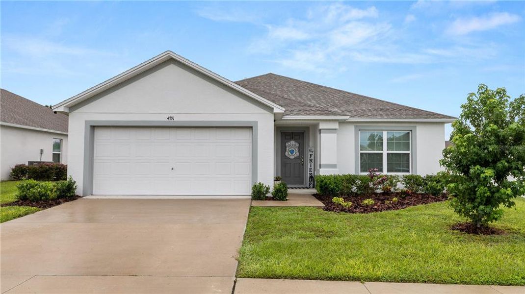 Front exterior of a new home in Gresham Farms Village, Lakeland, FL, highlighting curb appeal (Image 2). Front exterior of a new home in Gresham Farms Village, Lakeland, FL, highlighting curb appeal (Image 2).