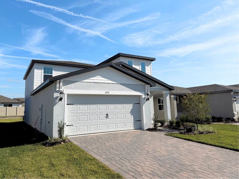 Front exterior of a new home in Two Rivers - Premier Series, Zephyrhills, FL, highlighting curb appeal (Image 2).