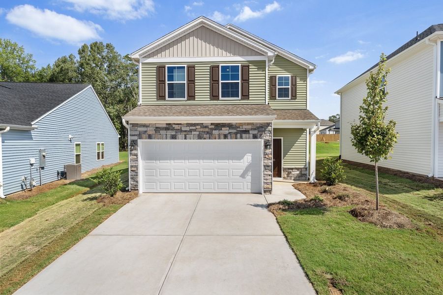 Front exterior of a new home in Mayfair Village, Spartanburg, SC, highlighting curb appeal (Image 1). Front exterior of a new home in Mayfair Village, Spartanburg, SC, highlighting curb appeal (Image 1).