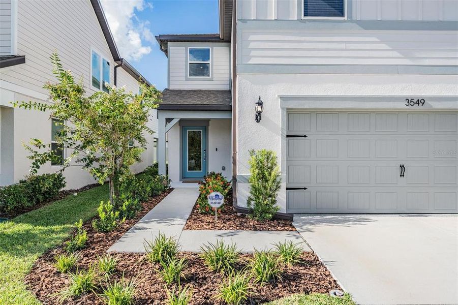 Front exterior of a new home in , Land O' Lakes, FL, highlighting curb appeal (Image 25).