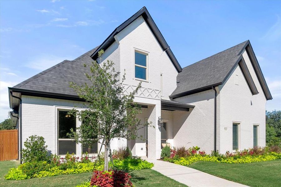 Gorgeous curb appeal adorns this beautiful home!