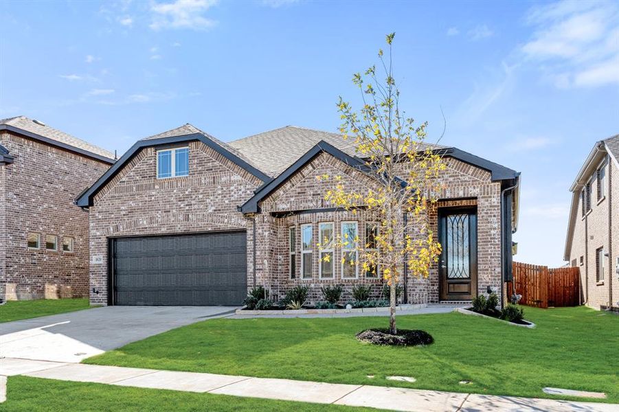 Front exterior of a new home in Eagle Glen Elements, Alvarado, TX, highlighting curb appeal (Image 2).