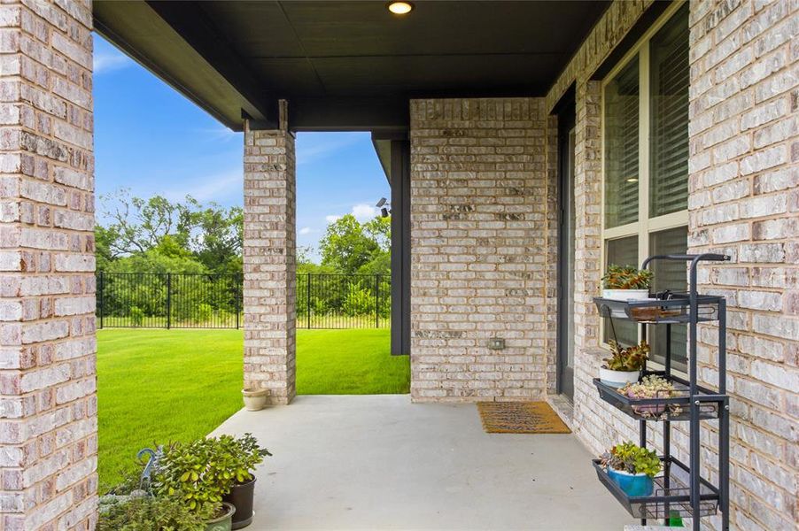 Exterior details and patio area of a home in , Providence Village (Image 28). Exterior details and patio area of a home in , Providence Village (Image 28).