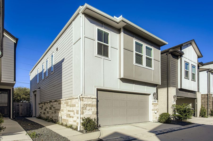 Front exterior of a new home in , Houston, TX, highlighting curb appeal (Image 1).