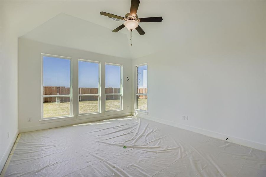 Unfurnished room featuring baseboards and a ceiling fan Unfurnished room featuring baseboards and a ceiling fan