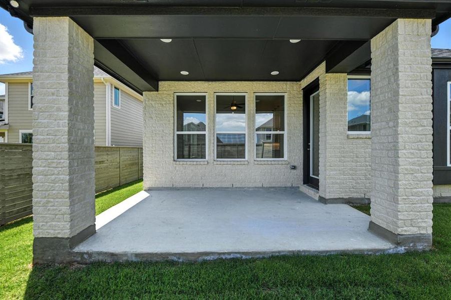 Exterior details and patio area of a home in Treeline, Justin (Image 2).