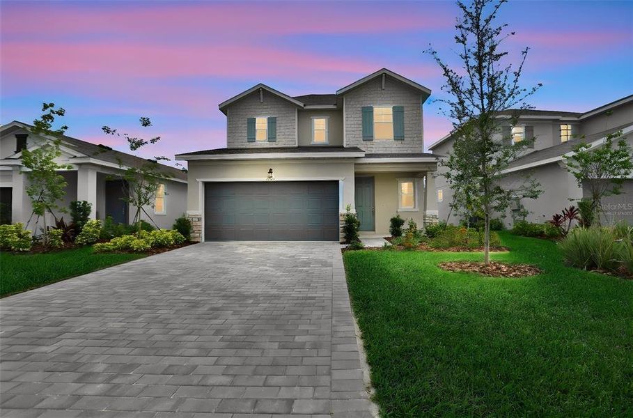 Front exterior of a new home in Turnleaf, Punta Gorda, FL, highlighting curb appeal (Image 22).