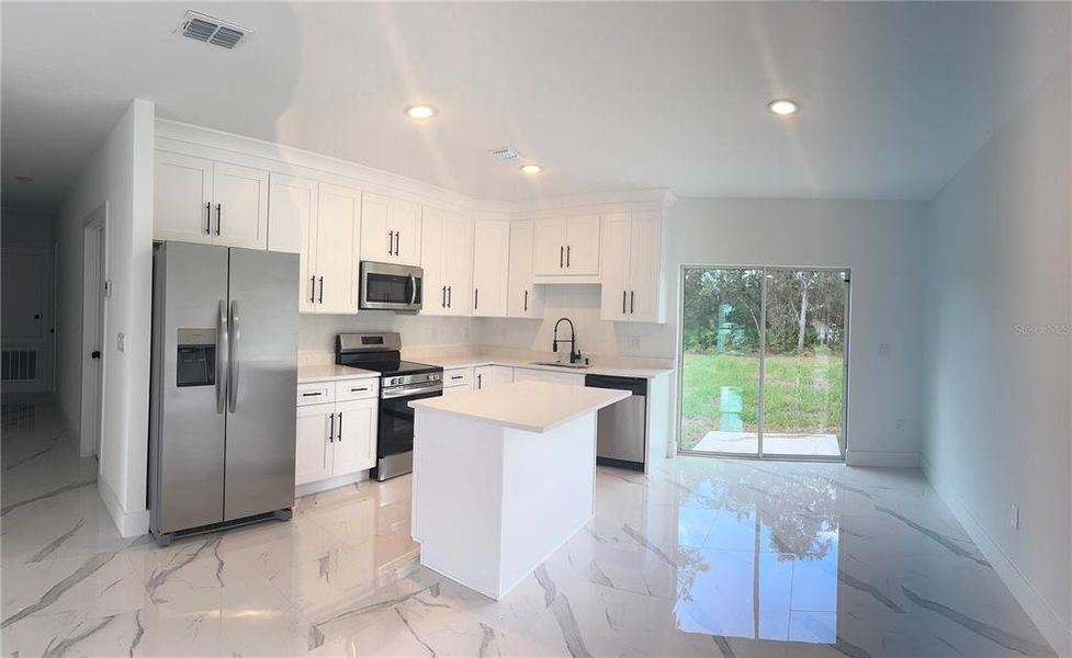 Furnished interior view inside a new home in , Dunnellon (Image 6).