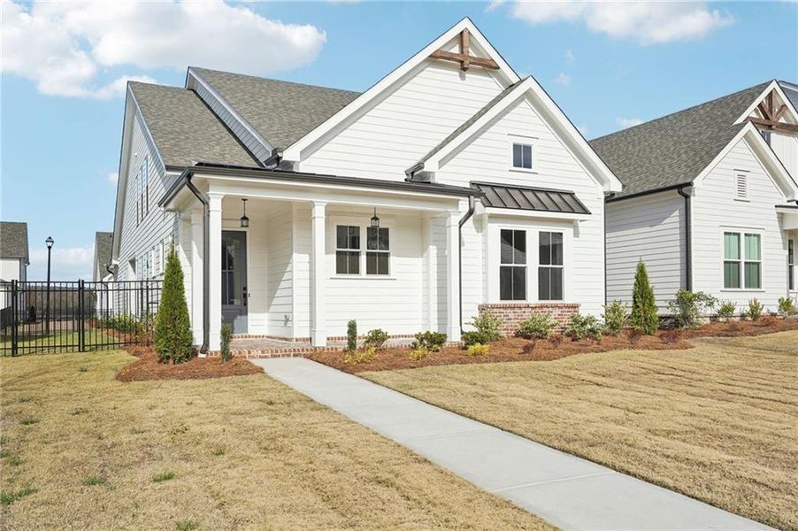 Front exterior of a new home in Promenade at Sawnee Village, Cumming, GA, highlighting curb appeal (Image 28).