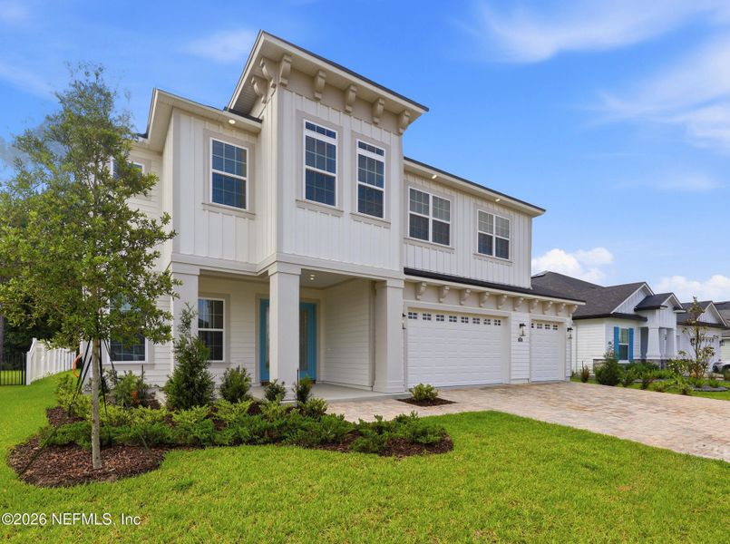 Front exterior of a new home in Silver Landing At Silverleaf, St. Augustine, FL, highlighting curb appeal (Image 28).