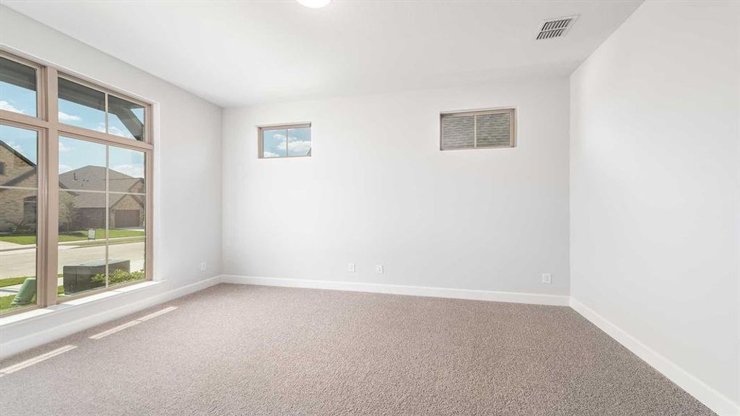 Unfurnished room featuring carpet flooring