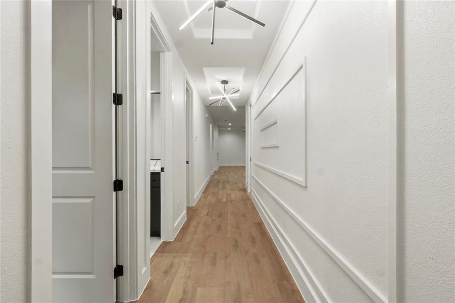 Corridor featuring light wood-type flooring Corridor featuring light wood-type flooring
