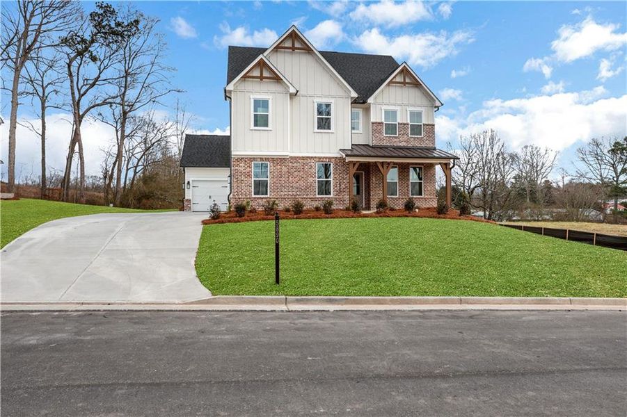 Front exterior of a new home in Acacia, Cumming, GA, highlighting curb appeal (Image 2).