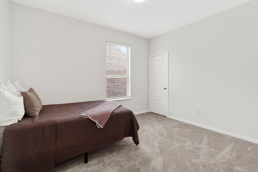 Fourth secondary bedroom featuring clean lines, plush carpet, and great natural light. Fourth secondary bedroom featuring clean lines, plush carpet, and great natural light.