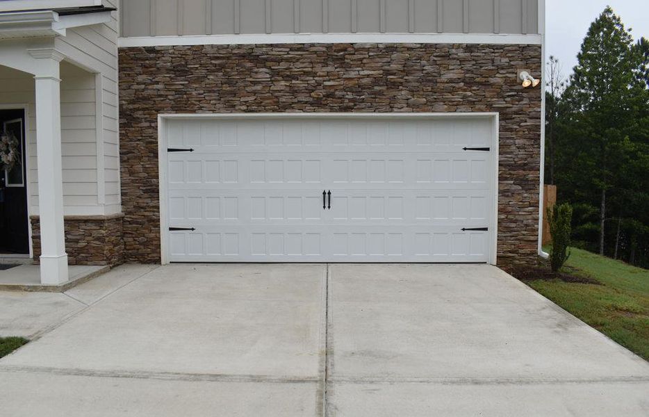 Front exterior of a new home in , Dallas, GA, highlighting curb appeal (Image 31). Front exterior of a new home in , Dallas, GA, highlighting curb appeal (Image 31).