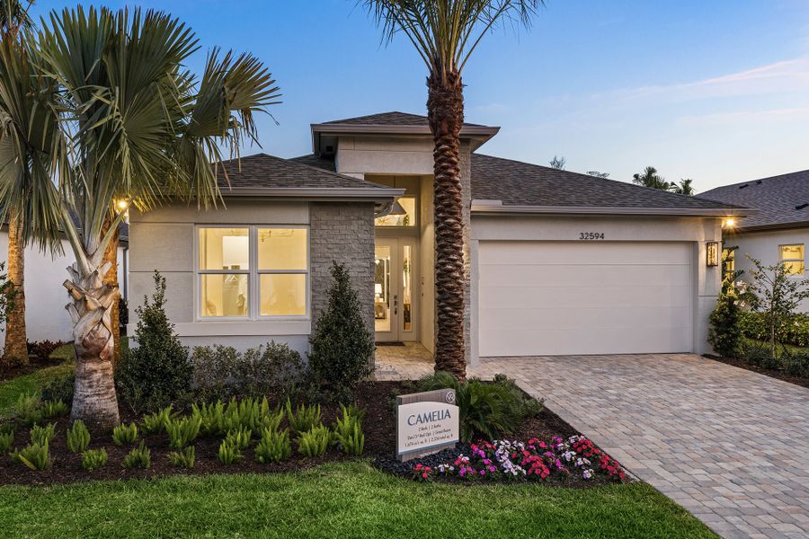 Front exterior of a new home in Valencia Ridge (55+), Wesley Chapel, FL, highlighting curb appeal (Image 1). Front exterior of a new home in Valencia Ridge (55+), Wesley Chapel, FL, highlighting curb appeal (Image 1).