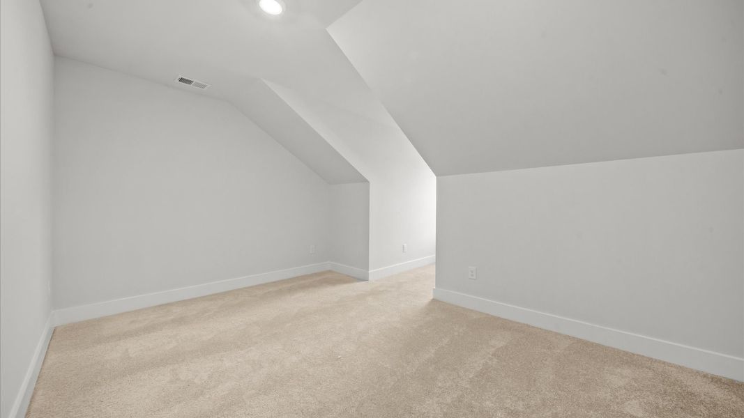 Stylish loft retreat with carpeted flooring and accomplished architectural detail