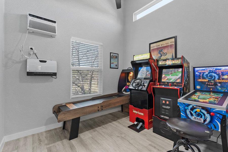 Flex room perfect as an office or game room featuring an AC wall unit