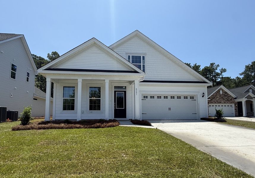 Front exterior of a new home in Arcadia, Myrtle Beach, SC, highlighting curb appeal (Image 1). Front exterior of a new home in Arcadia, Myrtle Beach, SC, highlighting curb appeal (Image 1).