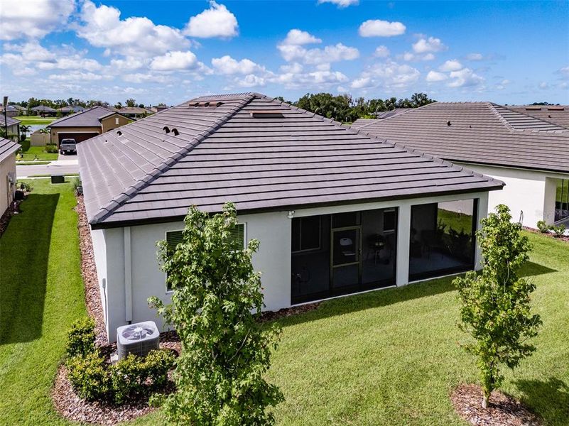 Exterior details and patio area of a home in Prosperity Lakes, Parrish (Image 34).