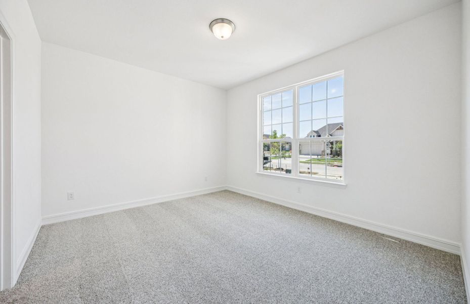 Spacious secondary bedroom*real home pictured