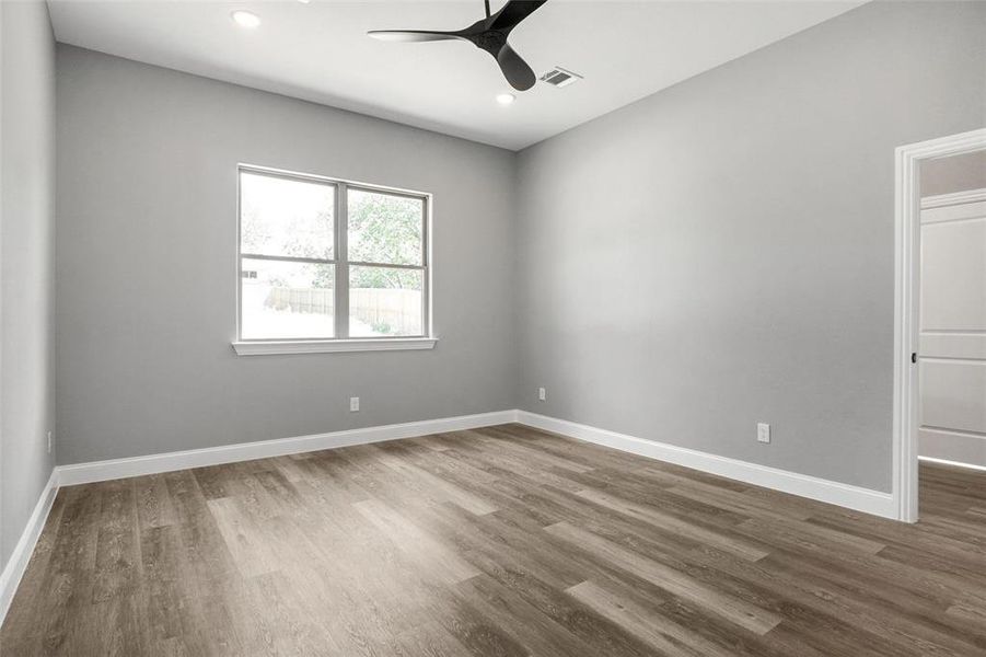 Unfurnished room with a ceiling fan, wood finished floors, and recessed lighting Unfurnished room with a ceiling fan, wood finished floors, and recessed lighting